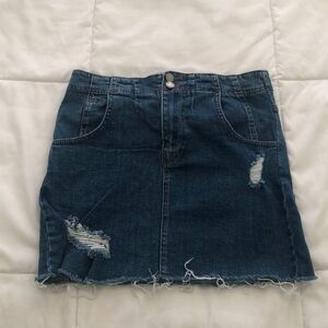 Free People mini denim skirt size 4 with cut off bottom and side fringes details